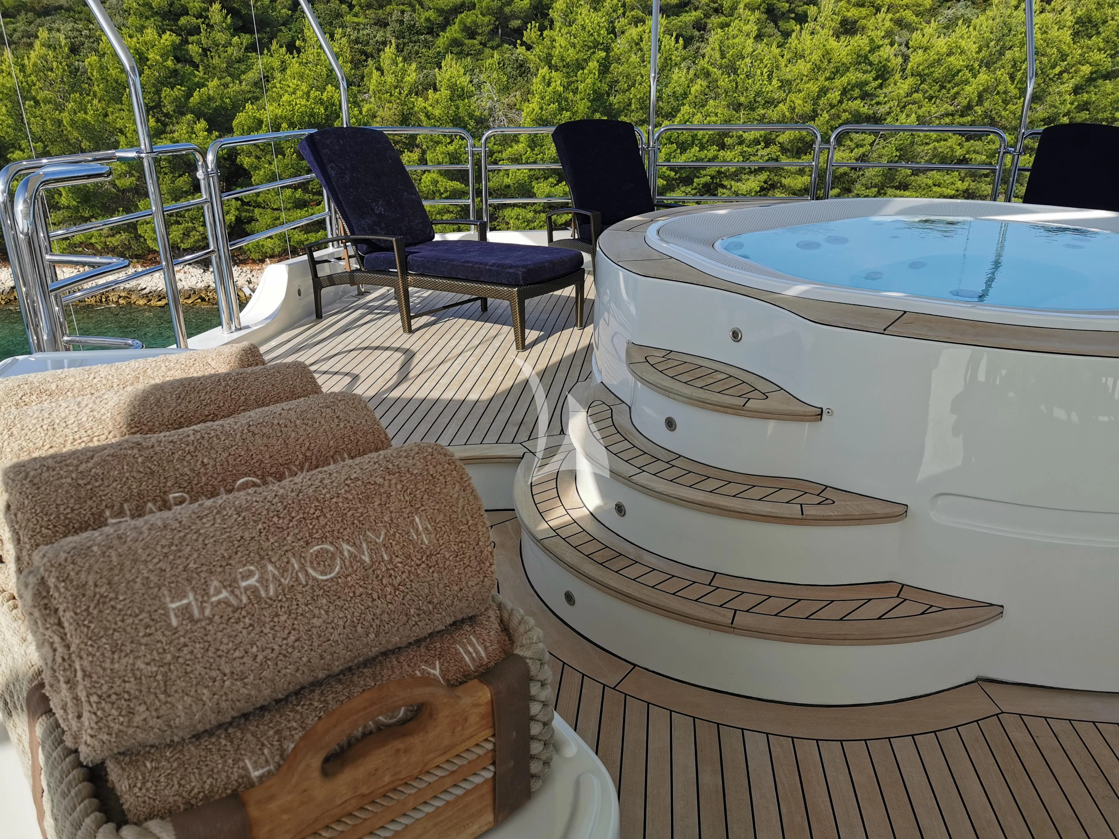 a pool table and chairs on a deck aboard EVERBLUE Yacht for Sale