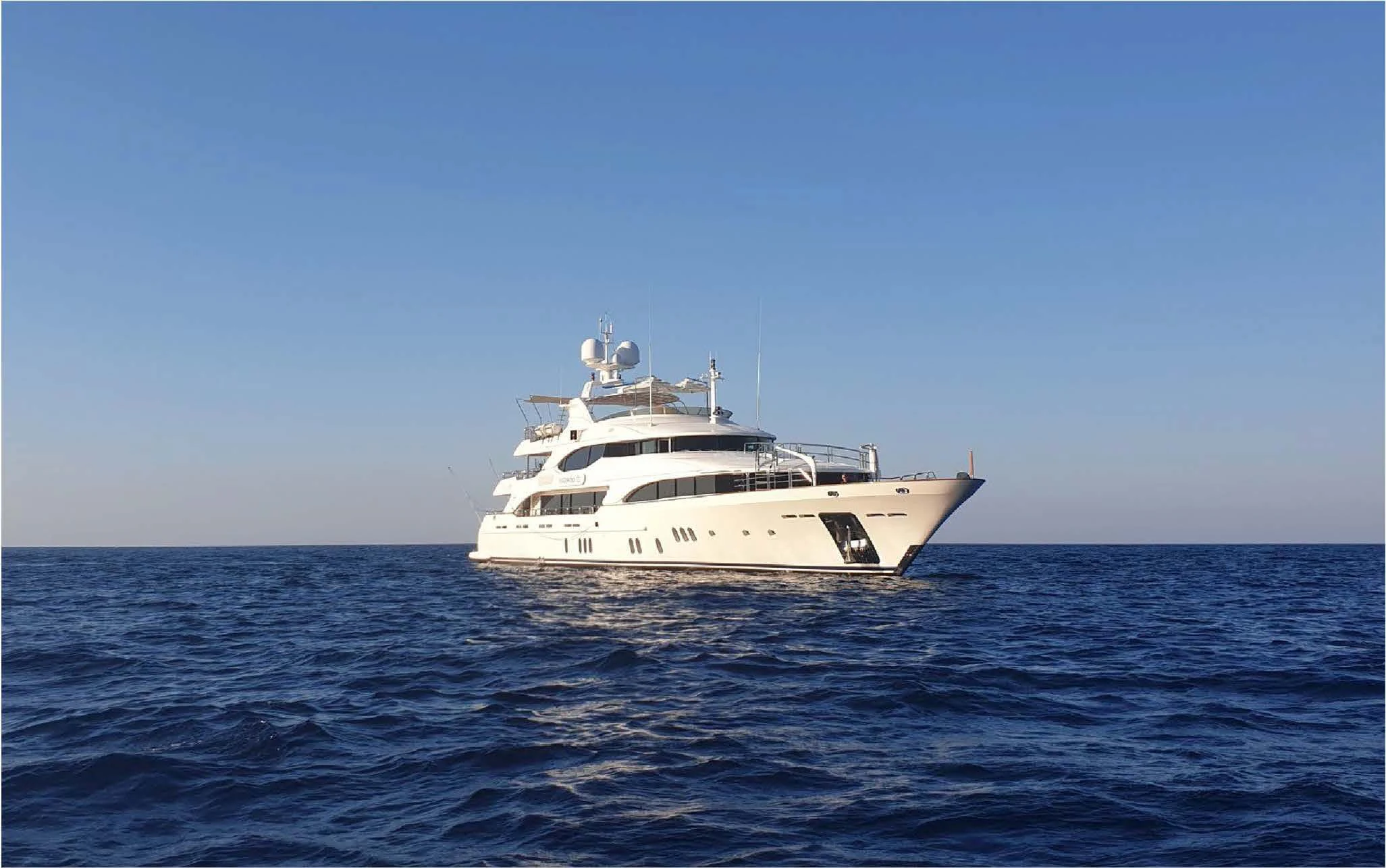 a white boat in the water aboard EVERBLUE Yacht for Sale