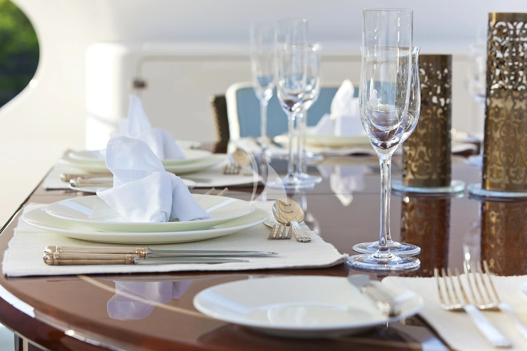 a table with plates and glasses aboard EVERBLUE Yacht for Sale