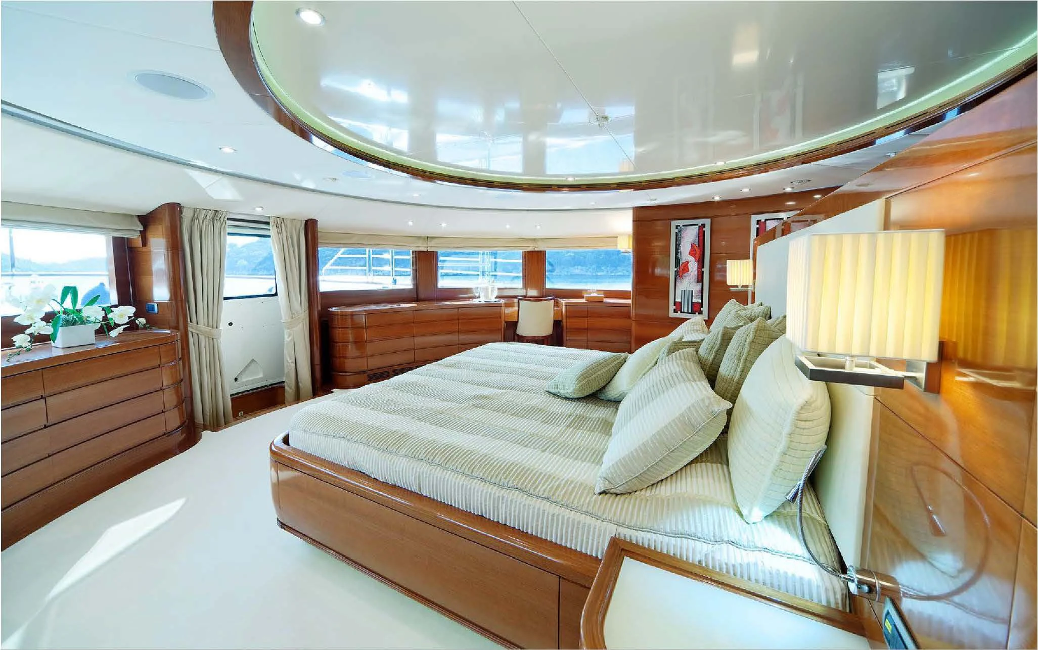 a room with a bed and a window aboard EVERBLUE Yacht for Sale