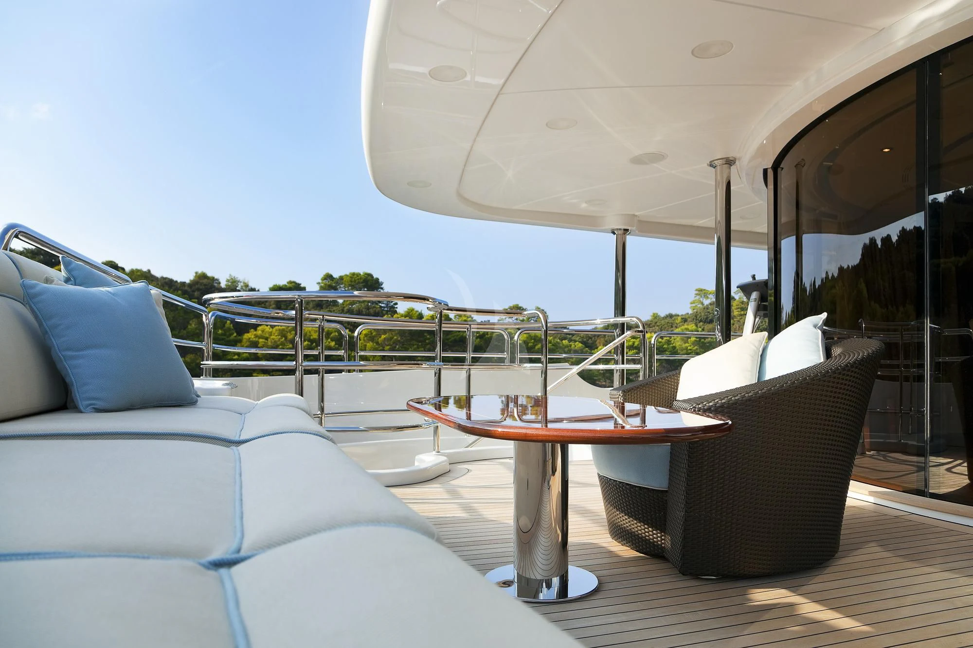 a table and chairs on a deck aboard EVERBLUE Yacht for Sale