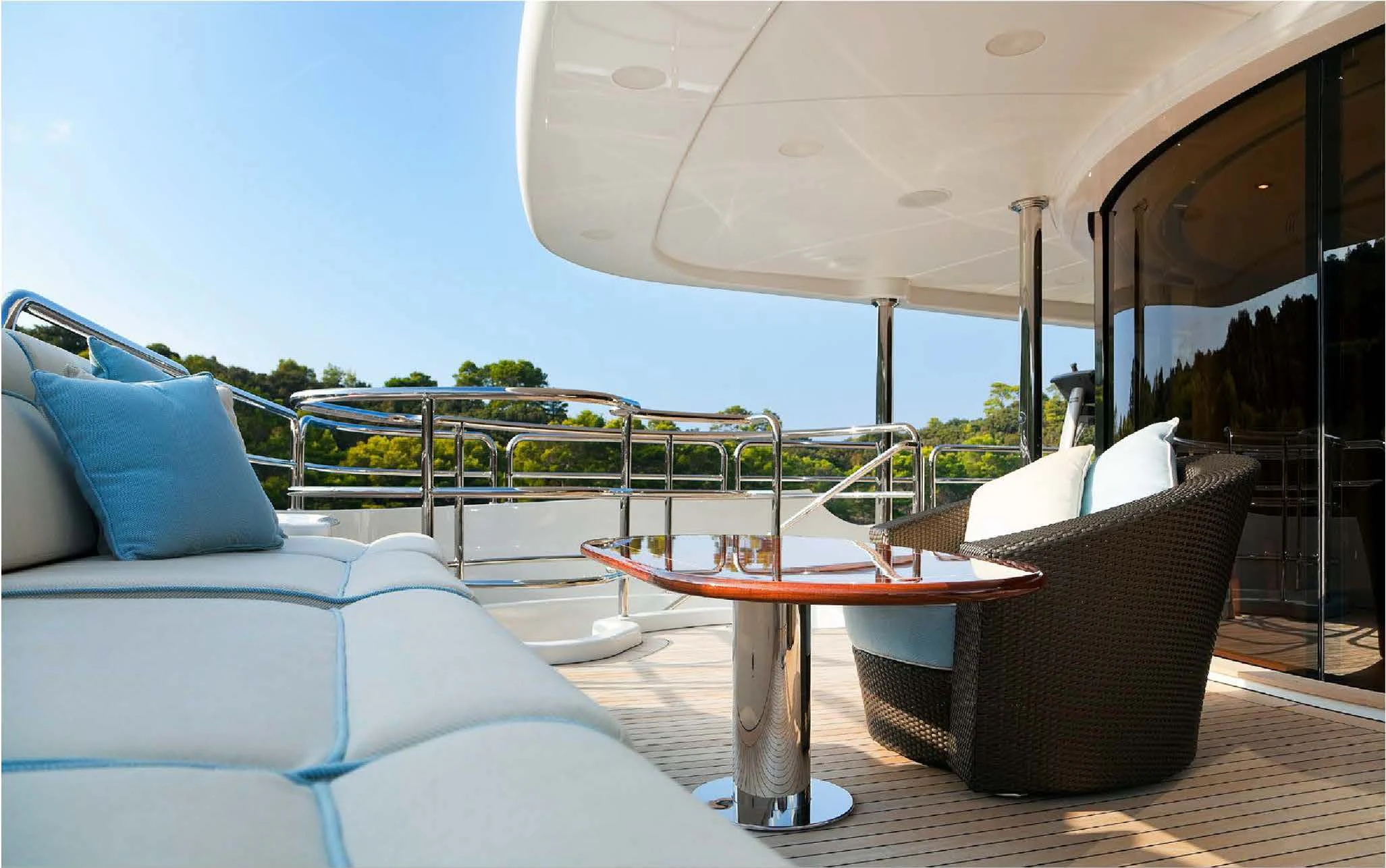 a table and chairs on a deck aboard EVERBLUE Yacht for Sale