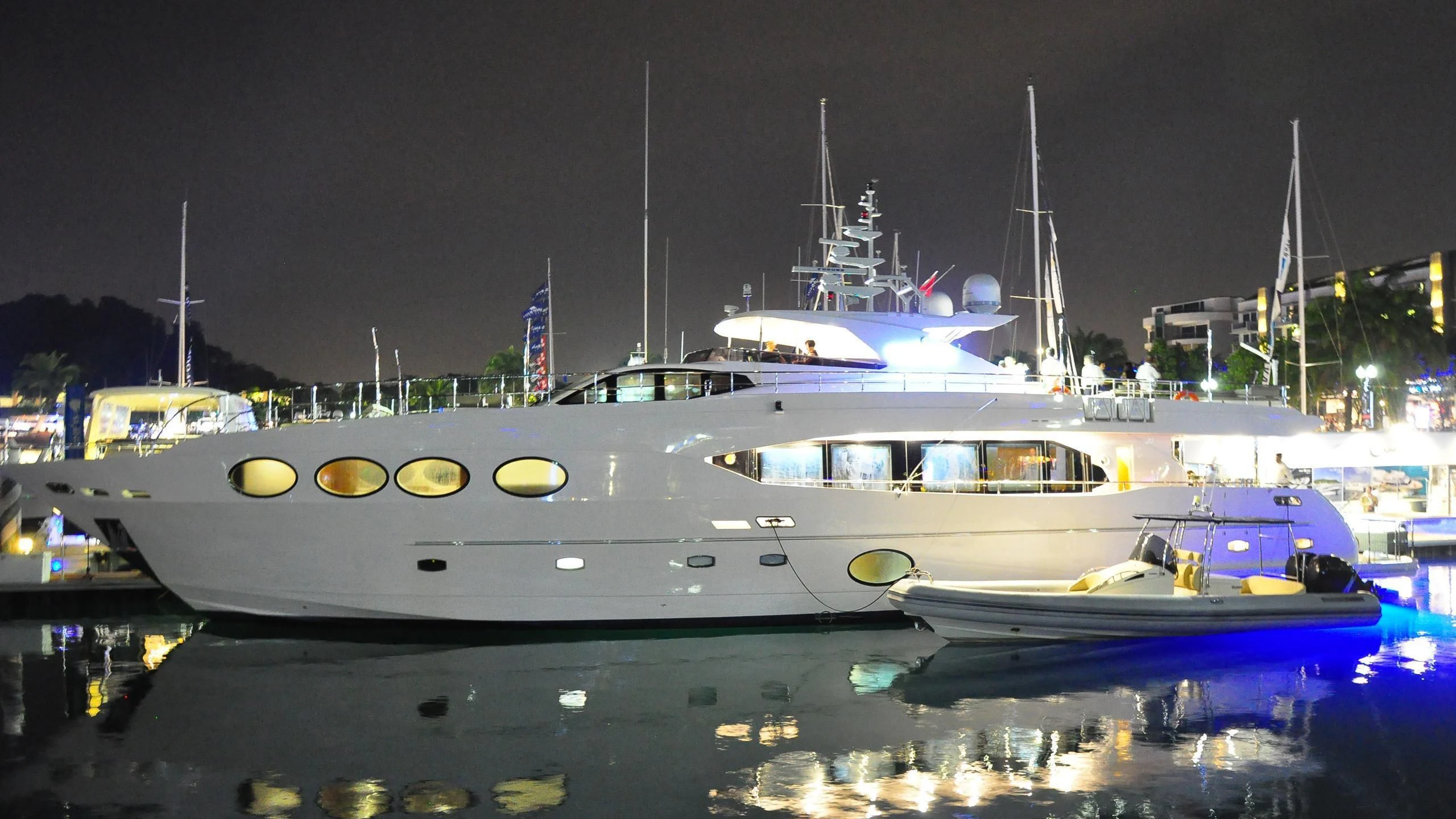 a couple of boats are parked in a harbor aboard MYKONOS Yacht for Sale