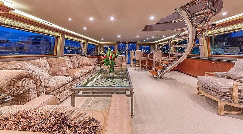 a living room with a staircase aboard ANDIAMO Yacht for Sale