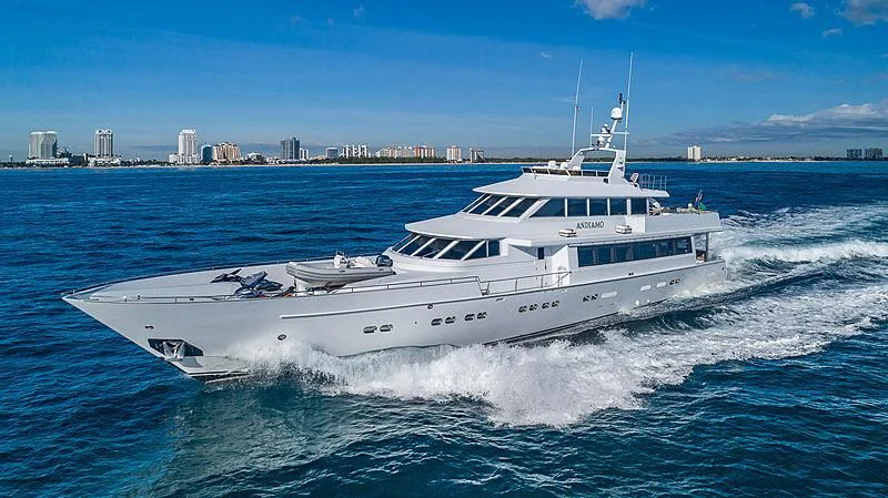 a white yacht on the water aboard ANDIAMO Yacht for Sale