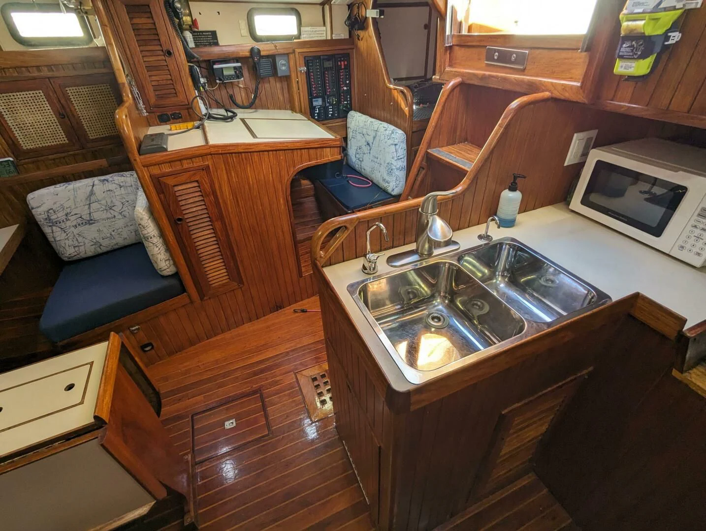 a kitchen with a sink and a couch aboard ANDIAMO Yacht for Sale