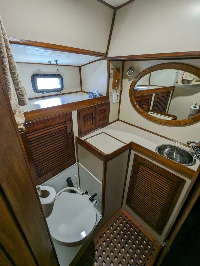 a bathroom with a sink and a toilet aboard ANDIAMO Yacht for Sale