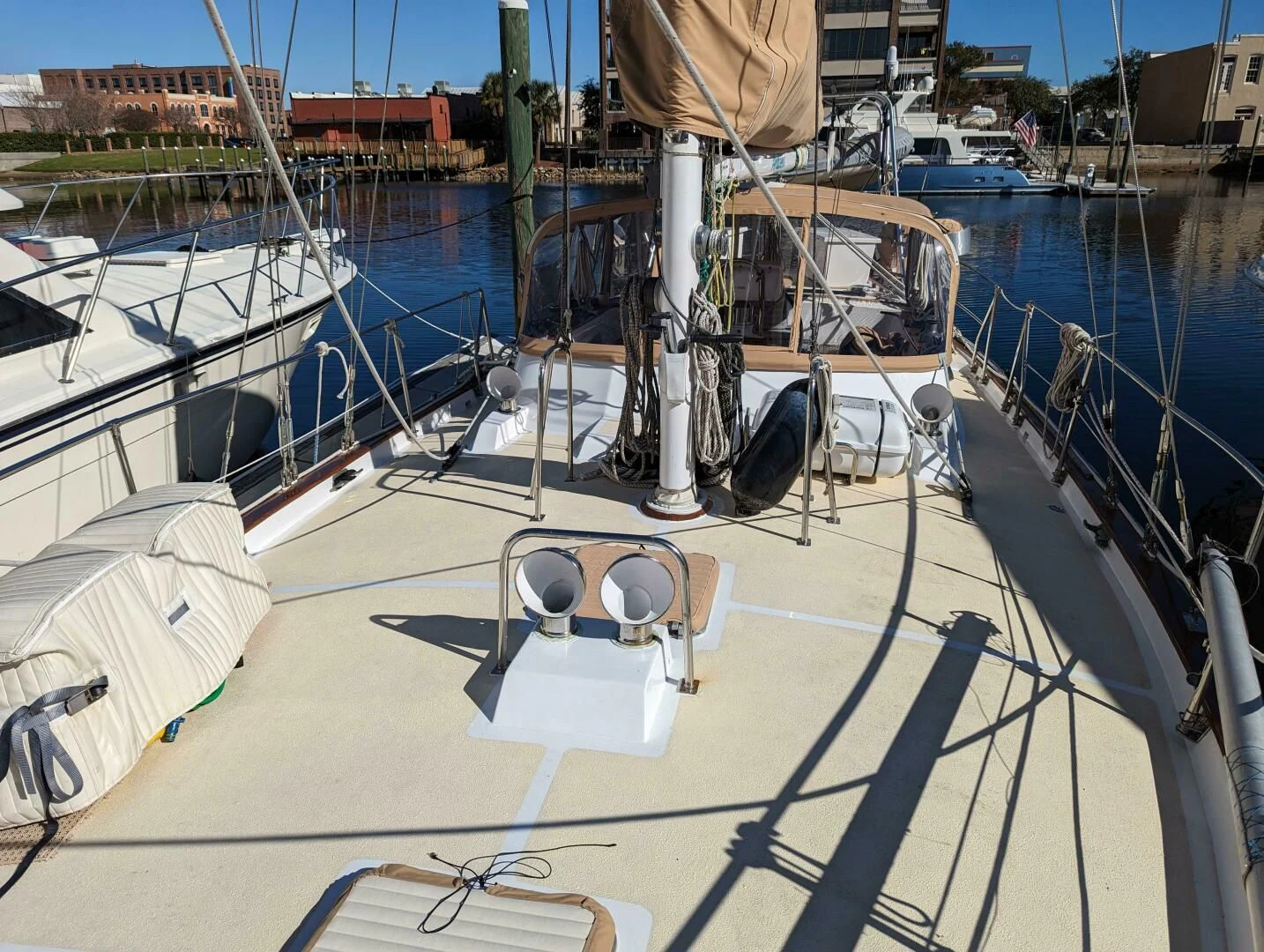 a boat dock with a chair and a table on it aboard ANDIAMO Yacht for Sale