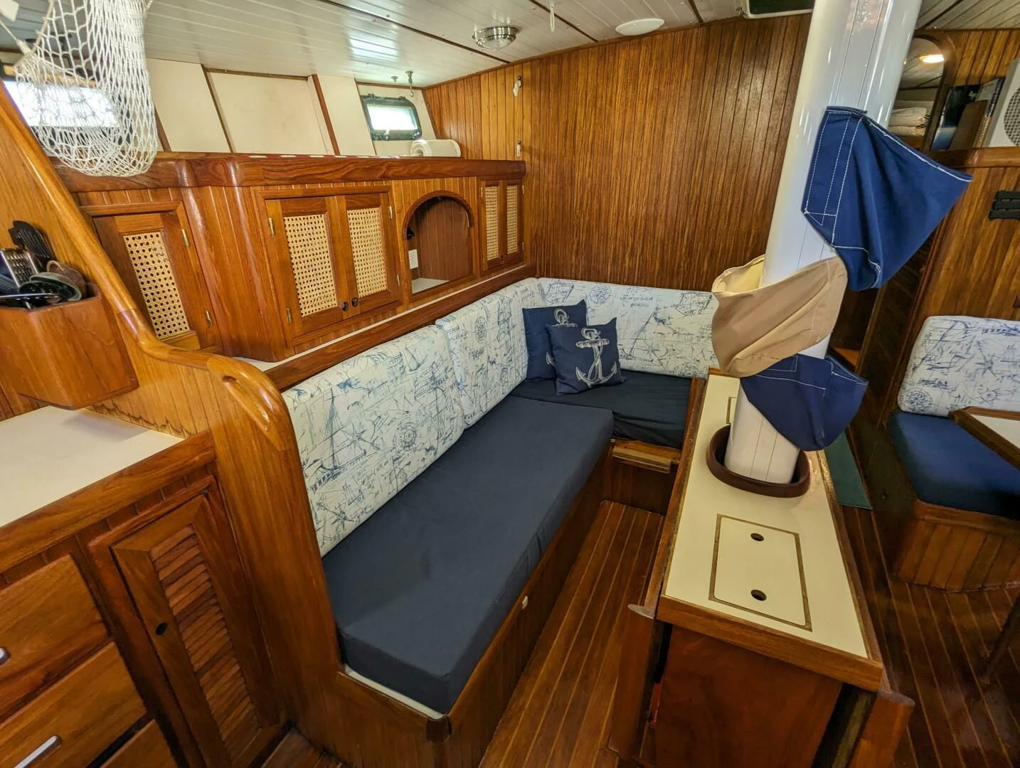 a room with a bed and a table aboard ANDIAMO Yacht for Sale