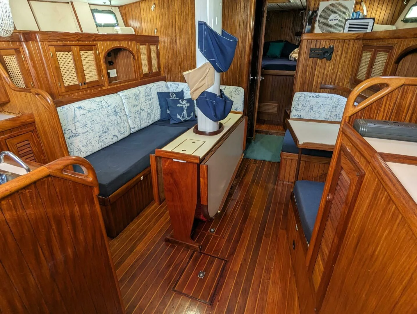 a room with a bed and desk aboard ANDIAMO Yacht for Sale