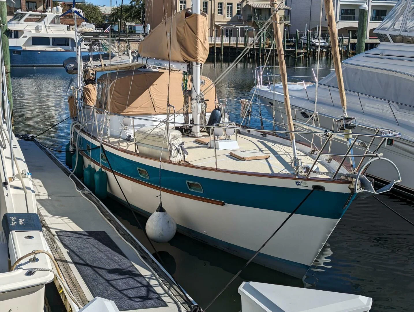 a boat docked in a harbor aboard ANDIAMO Yacht for Sale