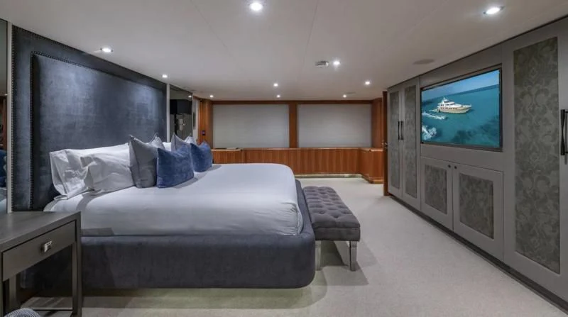 a room with a bed and a tv aboard SEA CLASS Yacht for Sale