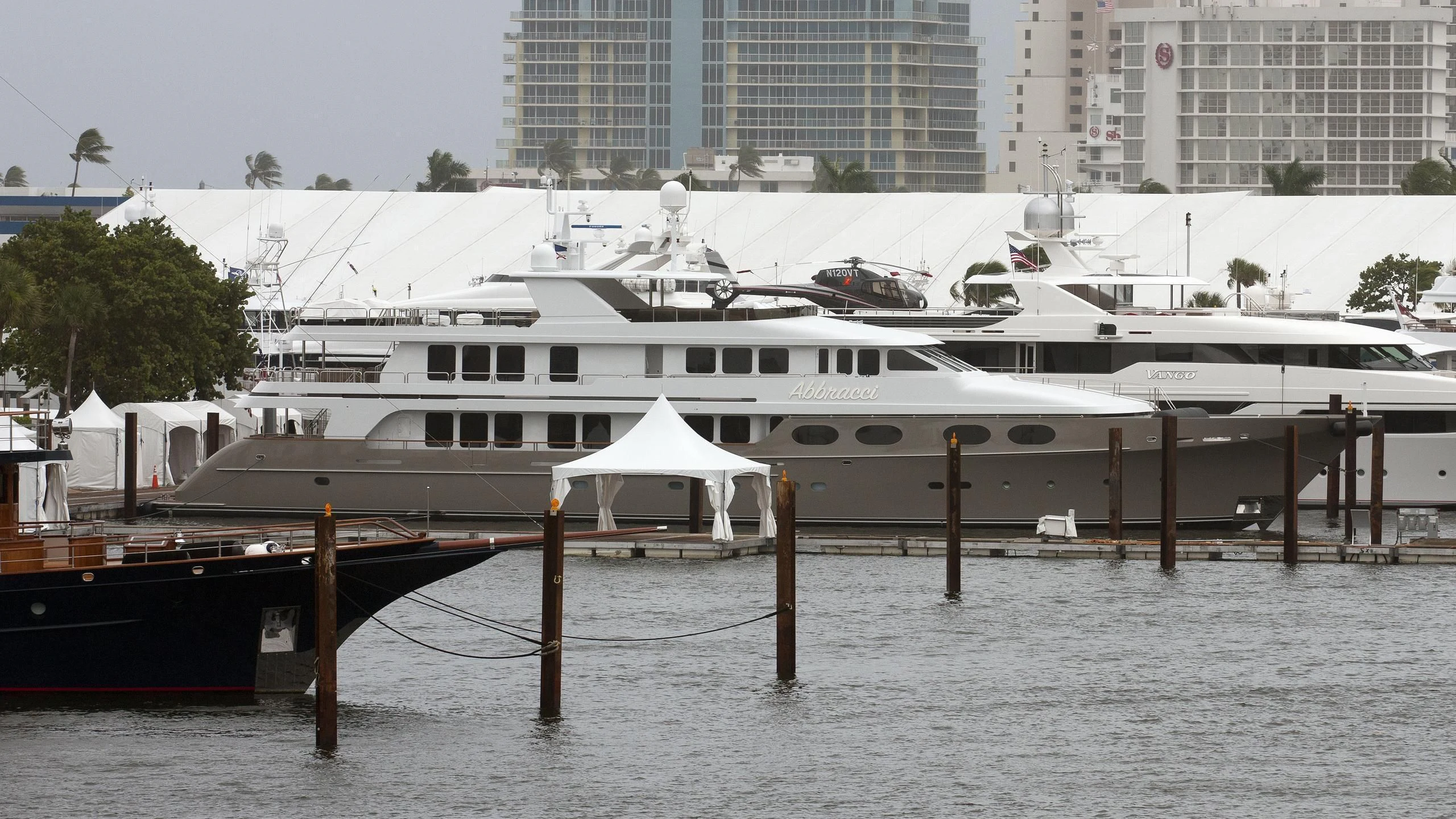 a large white boat in a harbor aboard SEA CLASS Yacht for Sale