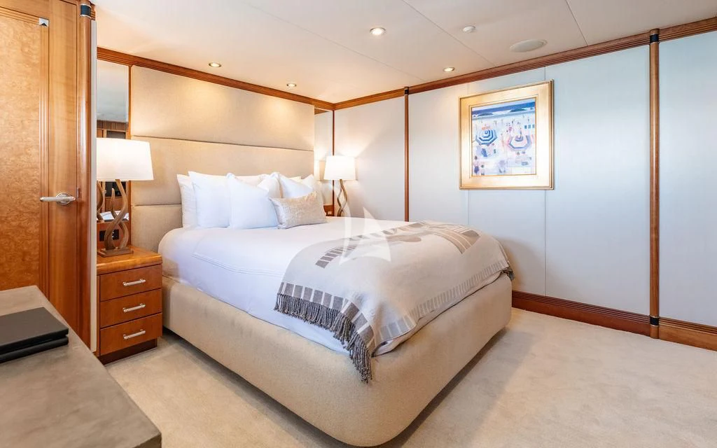 a bedroom with a bed and a desk aboard SEA CLASS Yacht for Sale
