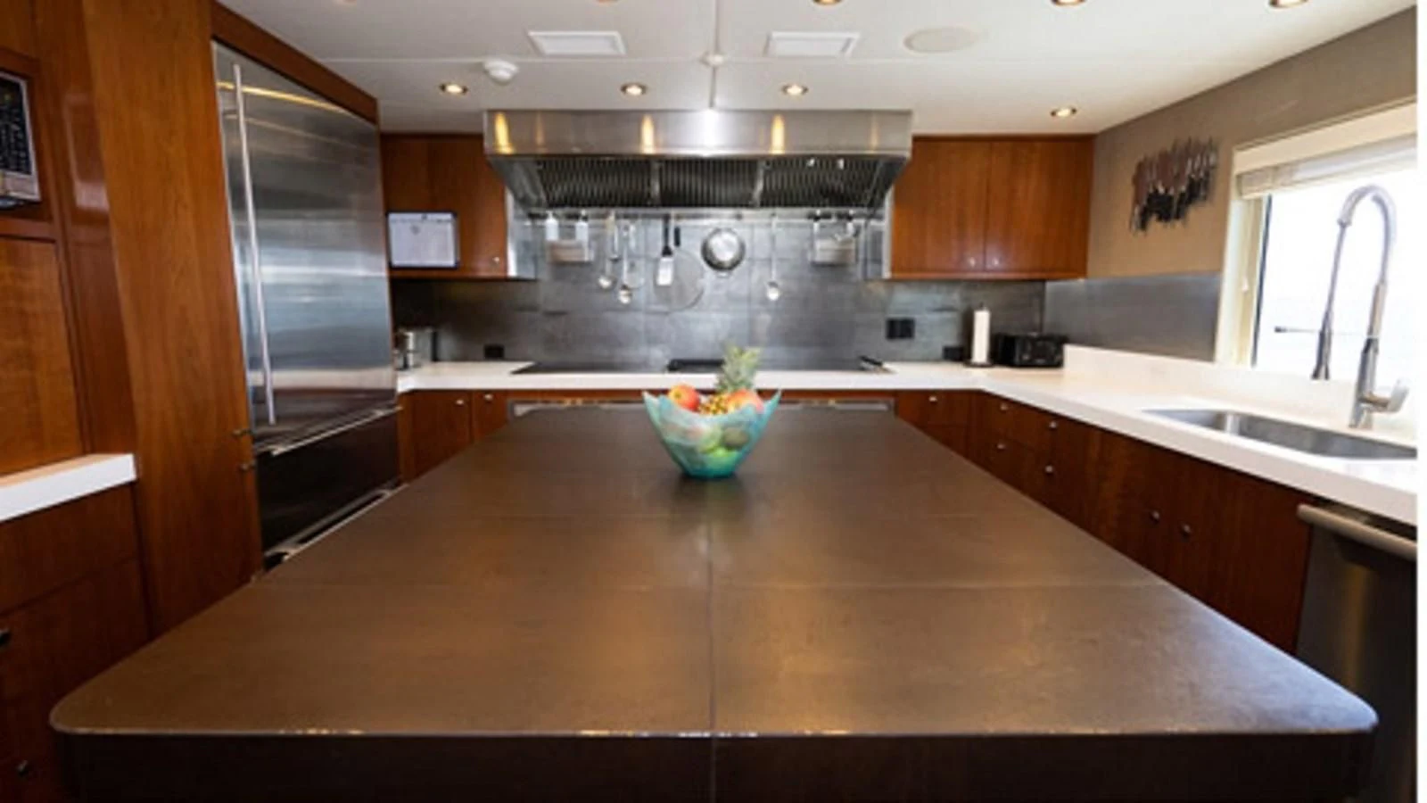 a kitchen with a large island aboard SEA CLASS Yacht for Sale