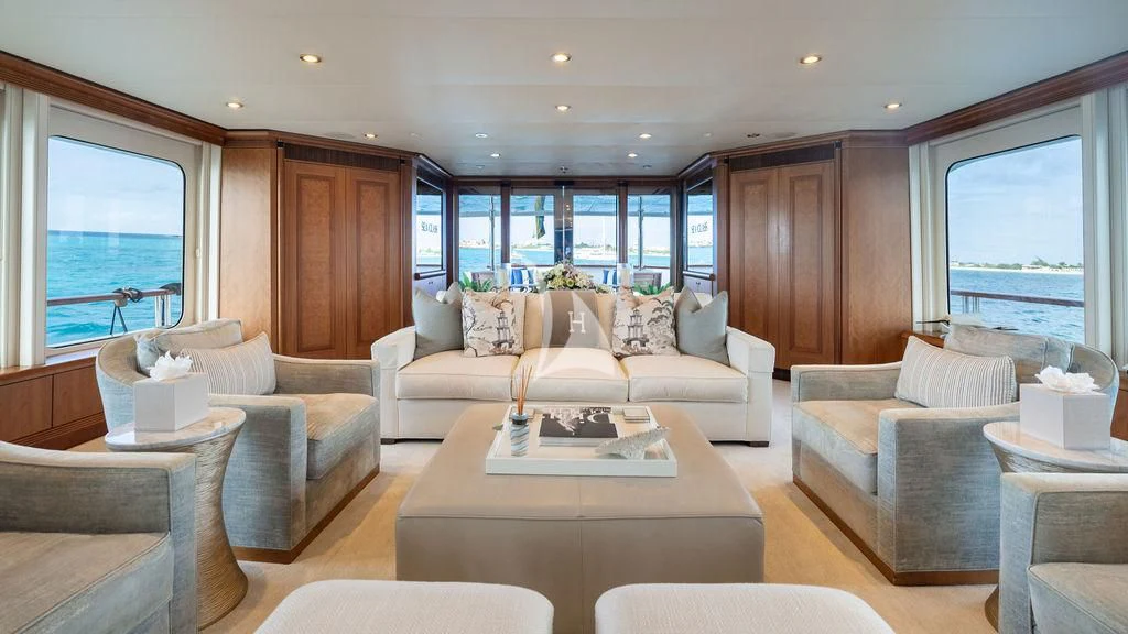a living room with a large window aboard SEA CLASS Yacht for Sale