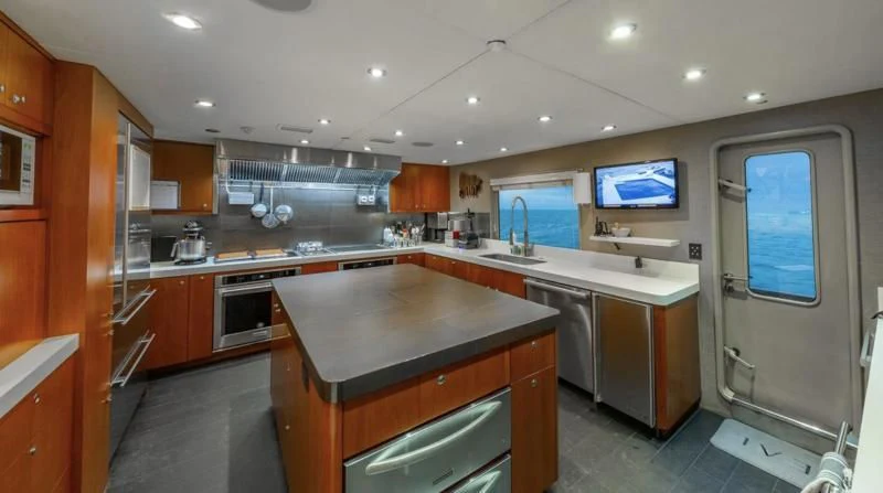a kitchen with a large island aboard SEA CLASS Yacht for Sale