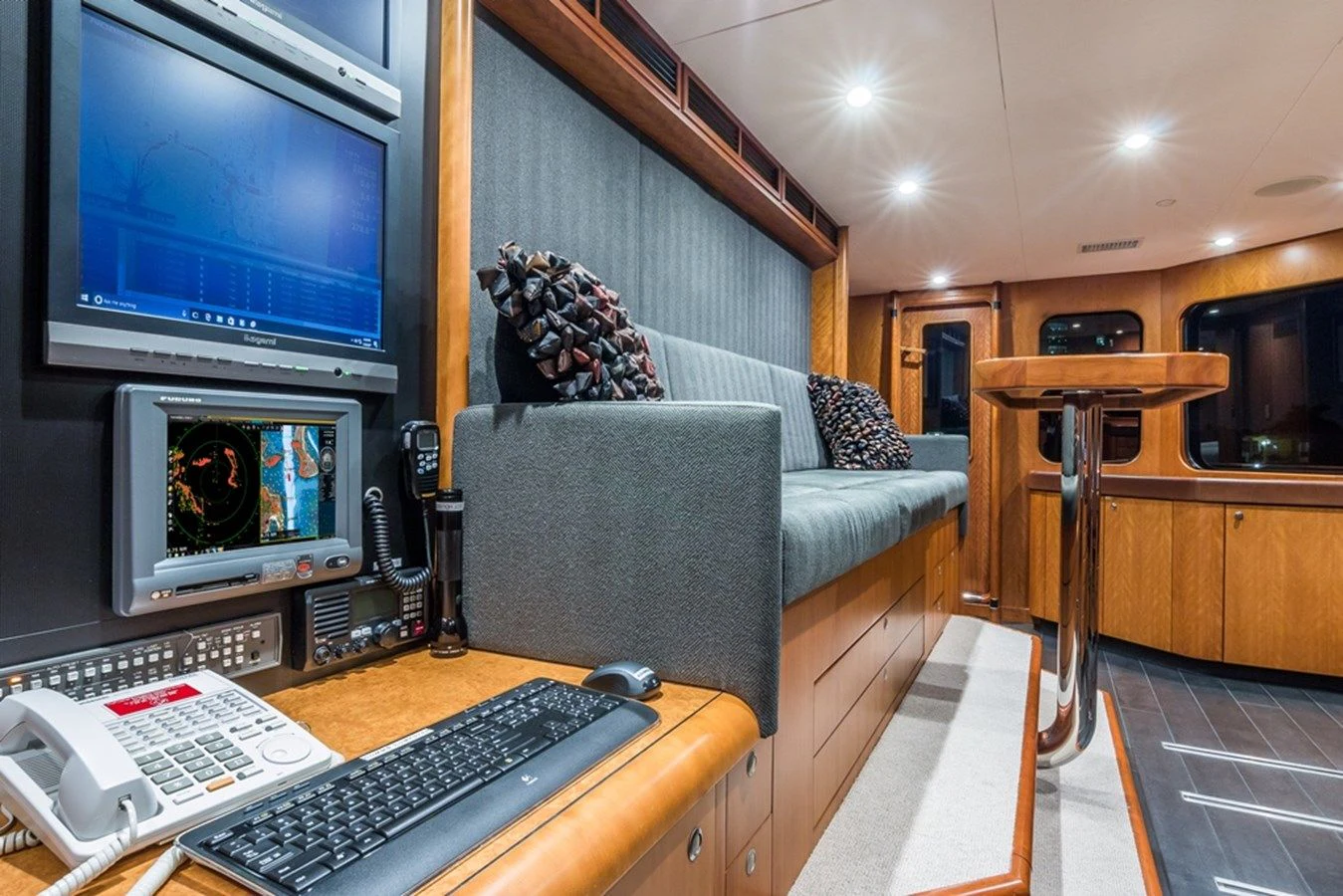 a living room with a computer and a television aboard SEA CLASS Yacht for Sale