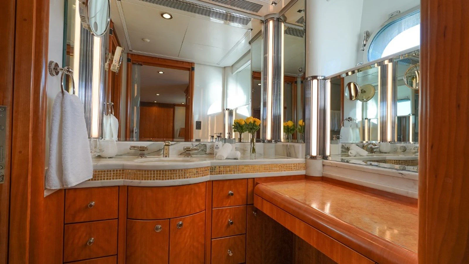 a bathroom with a large mirror aboard SEA CLASS Yacht for Sale