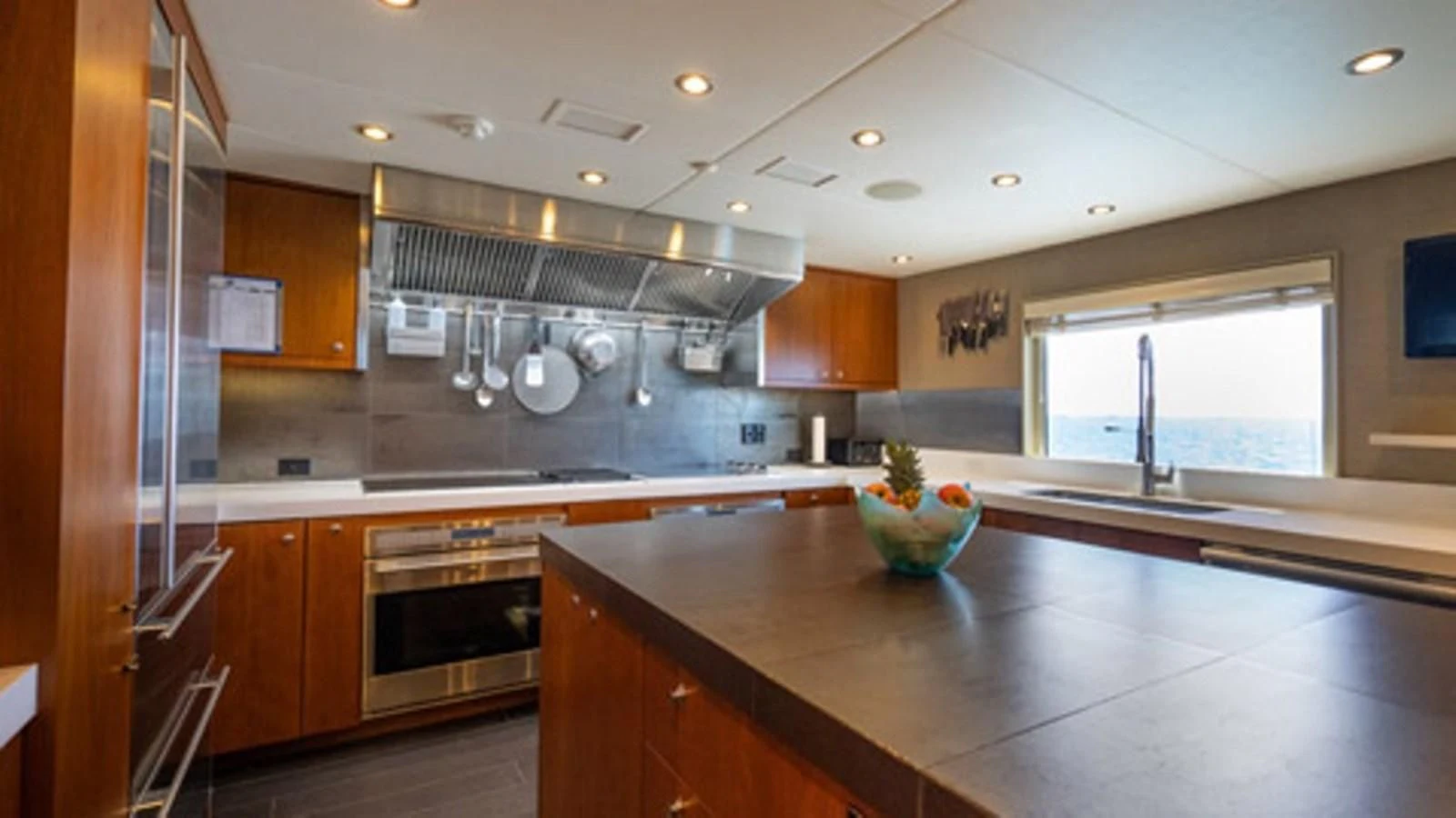 a kitchen with a large island aboard SEA CLASS Yacht for Sale