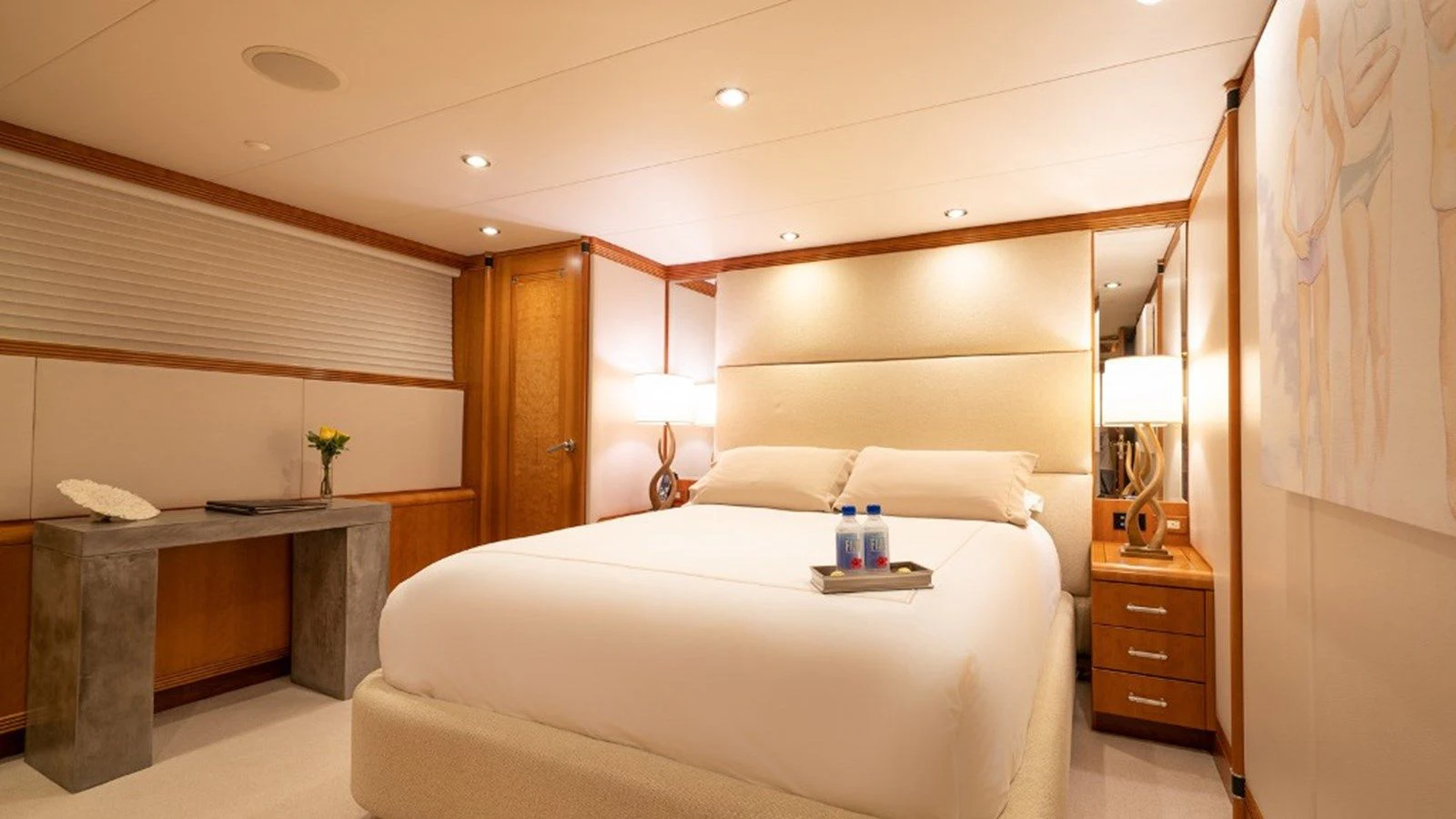 a bedroom with a bed and desk aboard SEA CLASS Yacht for Sale