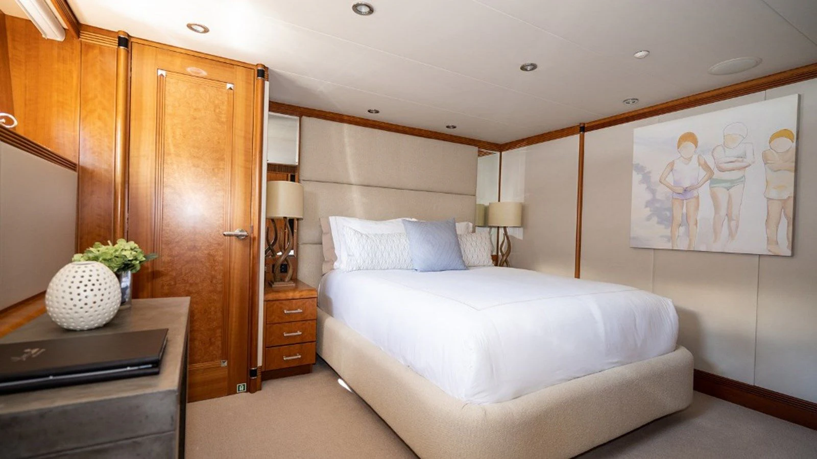 a bedroom with a bed and a cabinet aboard SEA CLASS Yacht for Sale