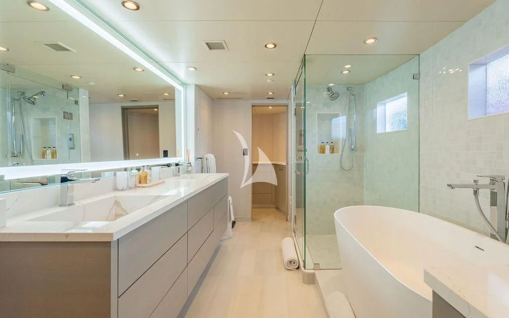 a bathroom with a glass shower aboard SEA CLASS Yacht for Sale