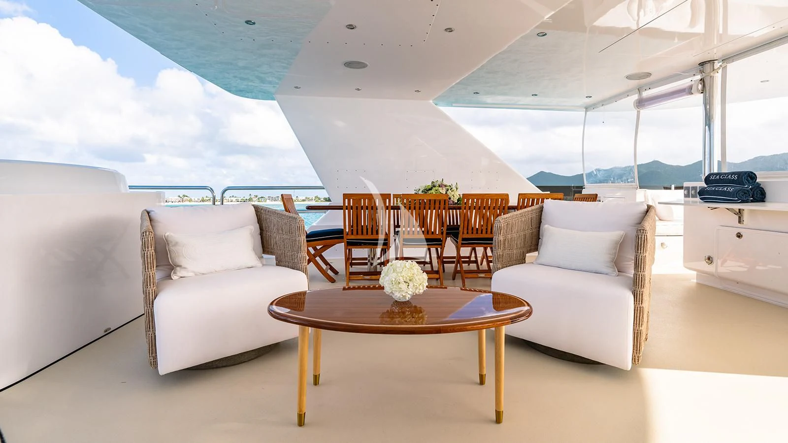 a living room with a table and chairs aboard SEA CLASS Yacht for Sale