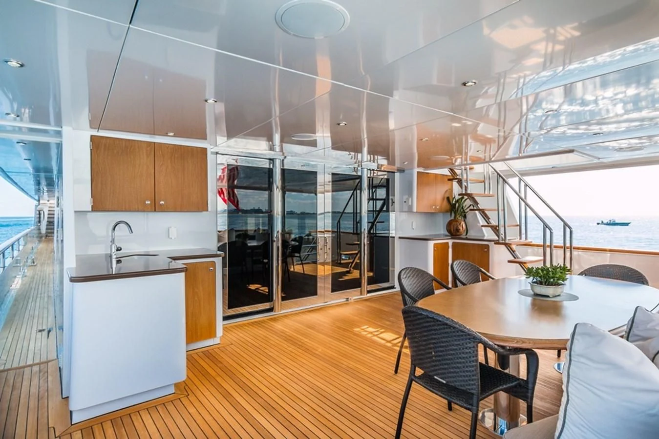 a modern kitchen with glass doors aboard SEA CLASS Yacht for Sale