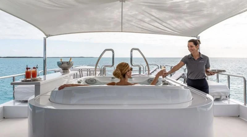 a person and a girl in a bathtub aboard SEA CLASS Yacht for Sale
