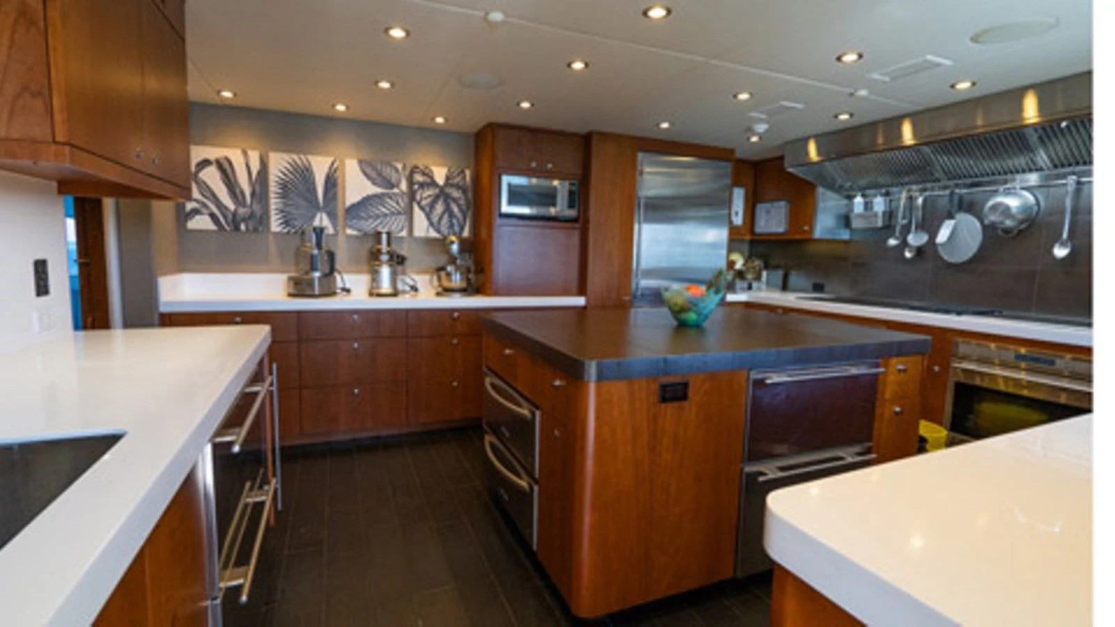 a kitchen with wooden cabinets aboard SEA CLASS Yacht for Sale