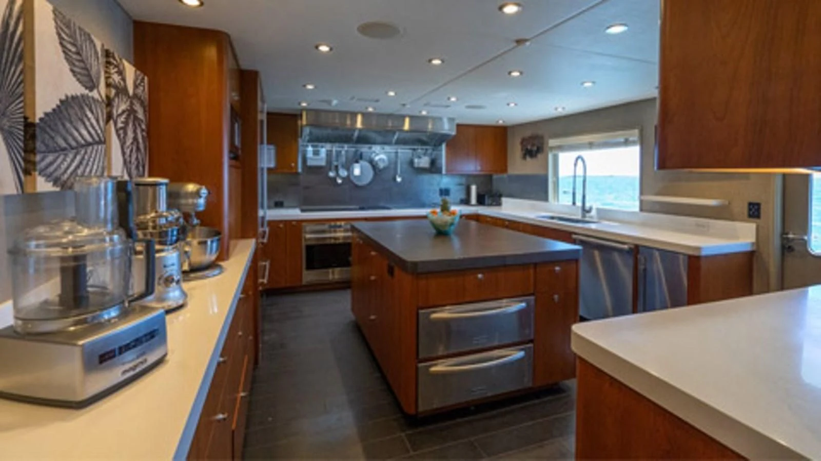 a kitchen with wooden cabinets aboard SEA CLASS Yacht for Sale