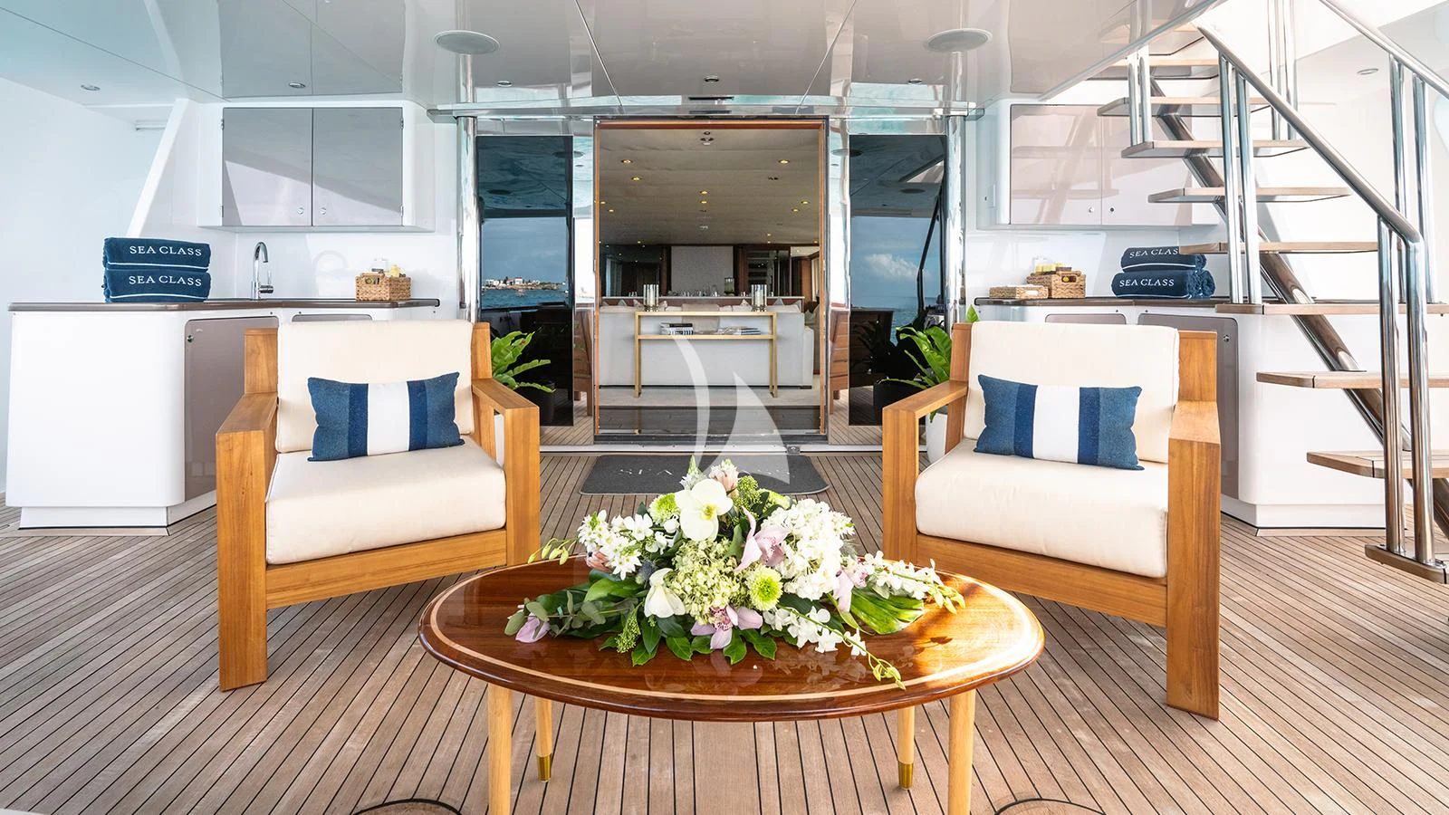 a room with a table and chairs aboard SEA CLASS Yacht for Sale