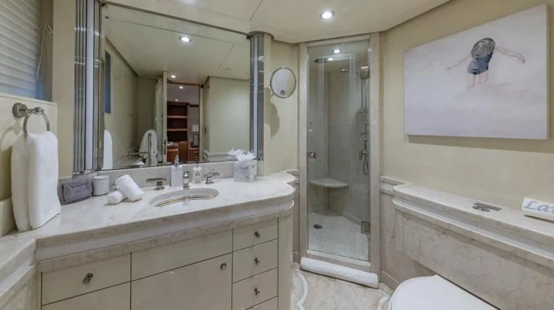 a bathroom with a large mirror aboard SEA CLASS Yacht for Sale
