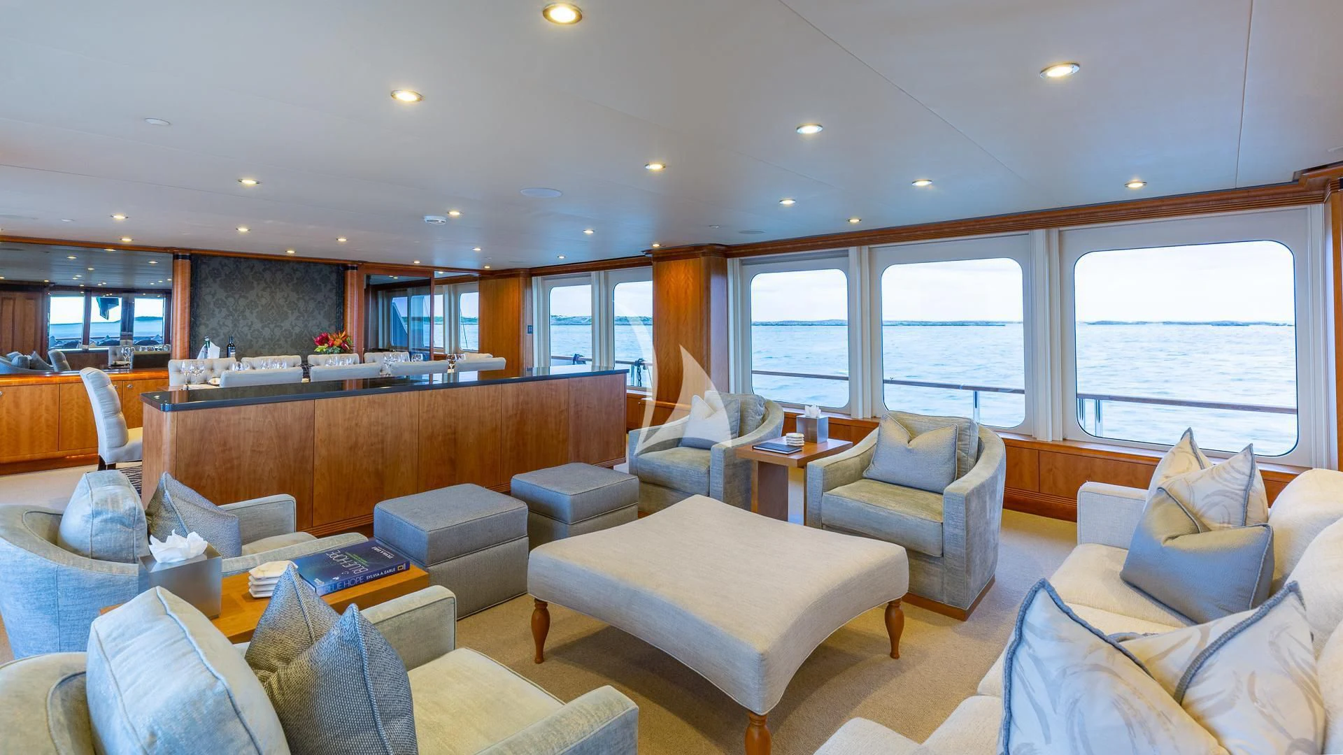 a living room with a large window aboard SEA CLASS Yacht for Sale