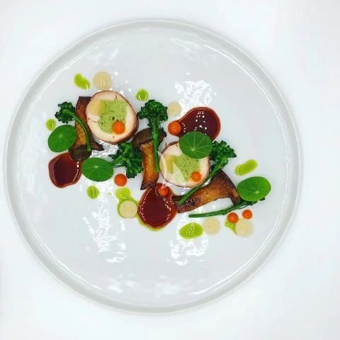 a plate of food aboard SEA CLASS Yacht for Sale