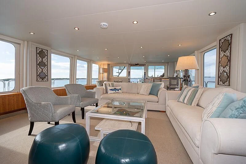 a living room with a couch and a coffee table aboard SEA CLASS Yacht for Sale
