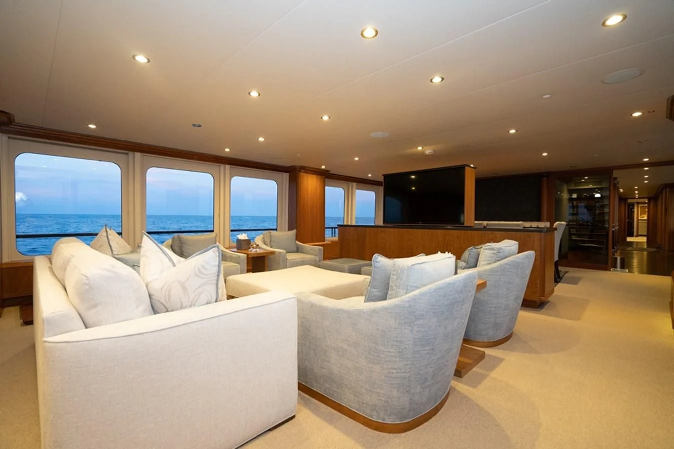 a large living room with a large window aboard SEA CLASS Yacht for Sale