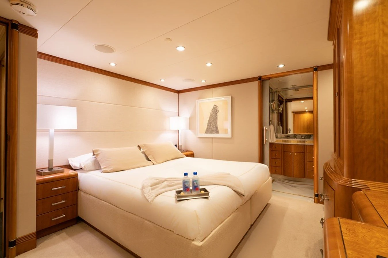 a hotel room with a bed and a mirror aboard SEA CLASS Yacht for Sale