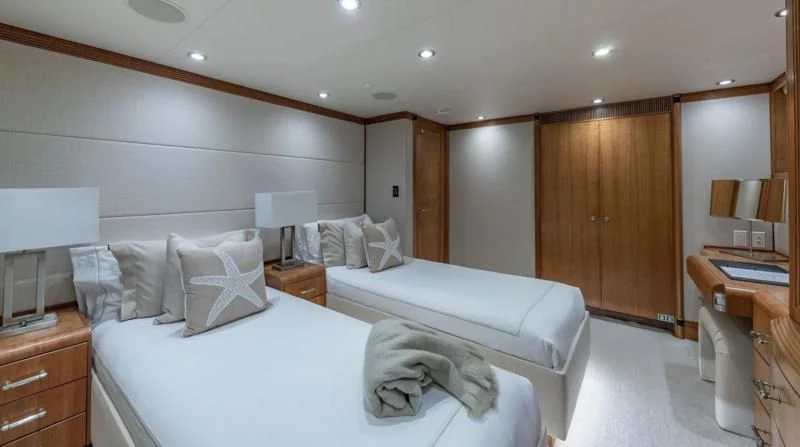 a bedroom with a bed and a desk aboard SEA CLASS Yacht for Sale