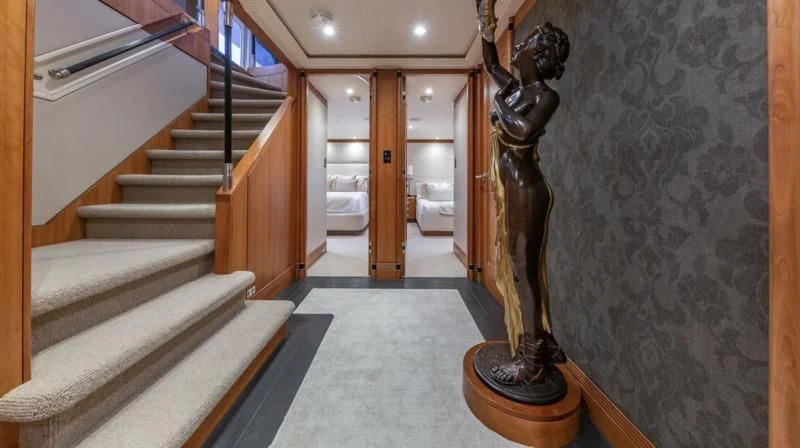 a hallway with a staircase and a staircase aboard SEA CLASS Yacht for Sale