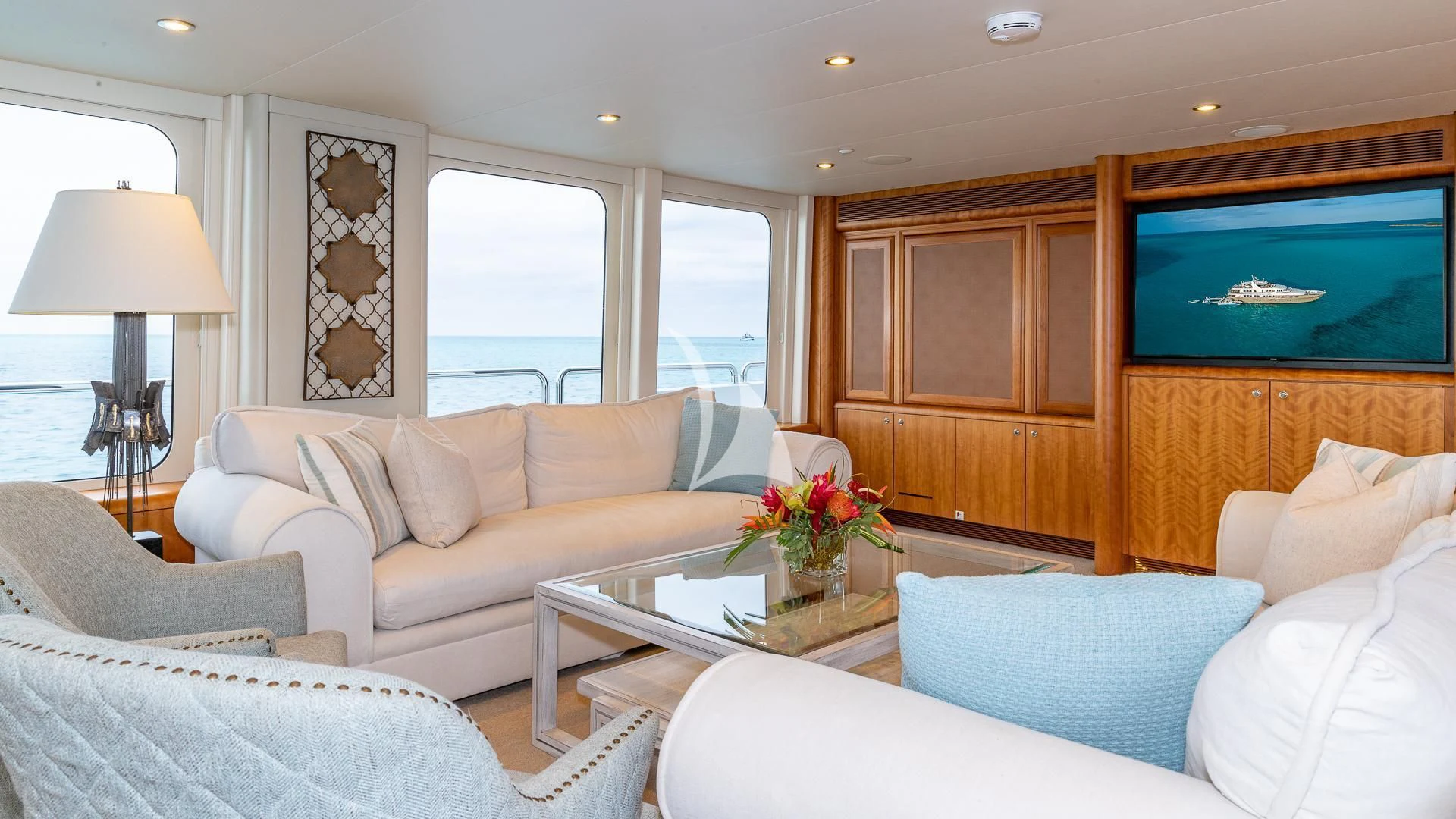 a living room with a large screen aboard SEA CLASS Yacht for Sale