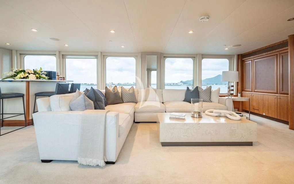 a living room with a couch and a table aboard SEA CLASS Yacht for Sale