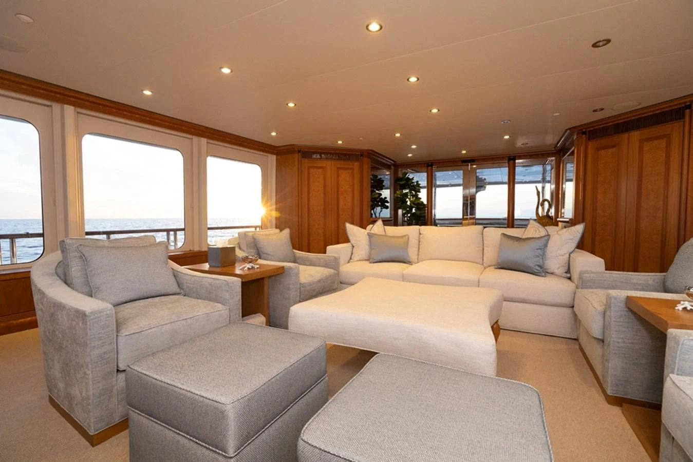a living room with a couch and a table aboard SEA CLASS Yacht for Sale