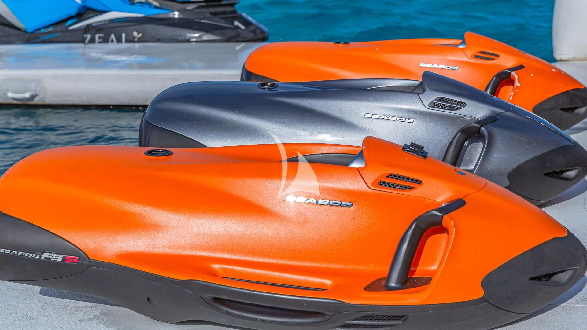 an orange and black sports car aboard SEA CLASS Yacht for Sale