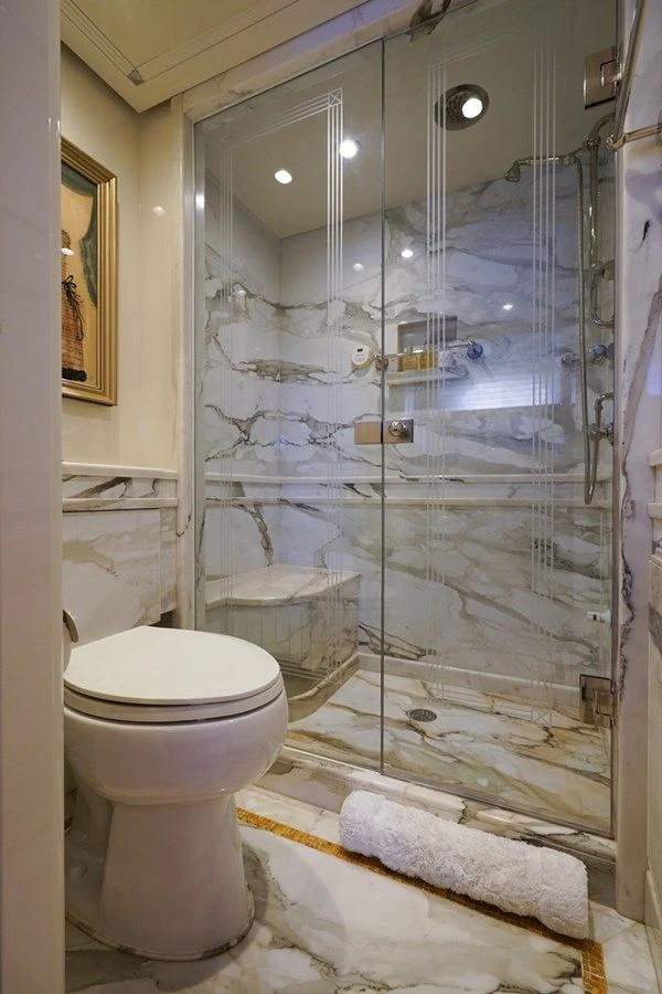 a bathroom with a glass shower aboard SEA CLASS Yacht for Sale