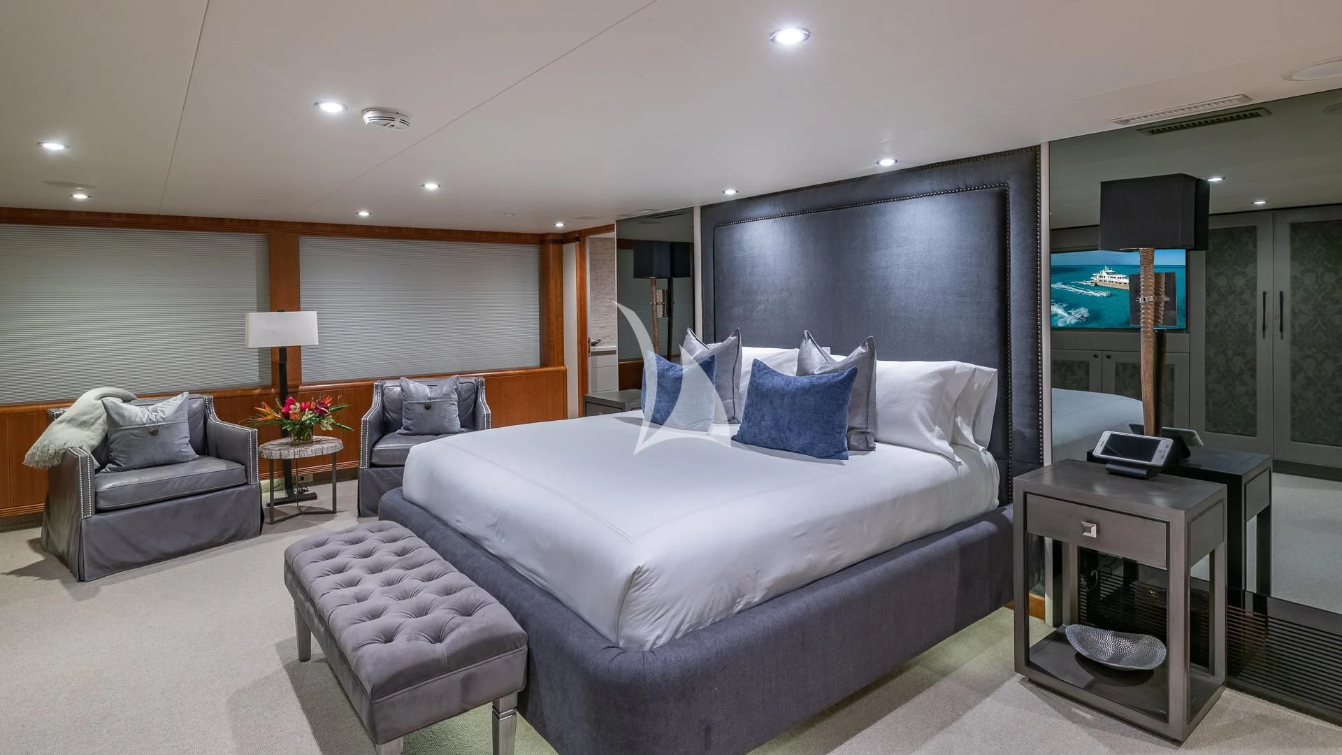 a bedroom with a bed and a television aboard SEA CLASS Yacht for Sale
