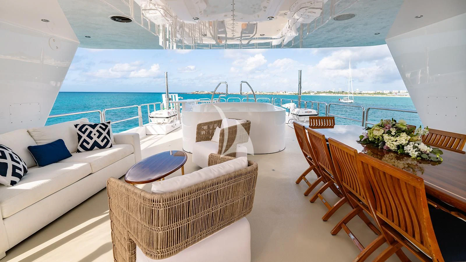 a room with a table chairs and a large white sofa aboard SEA CLASS Yacht for Sale