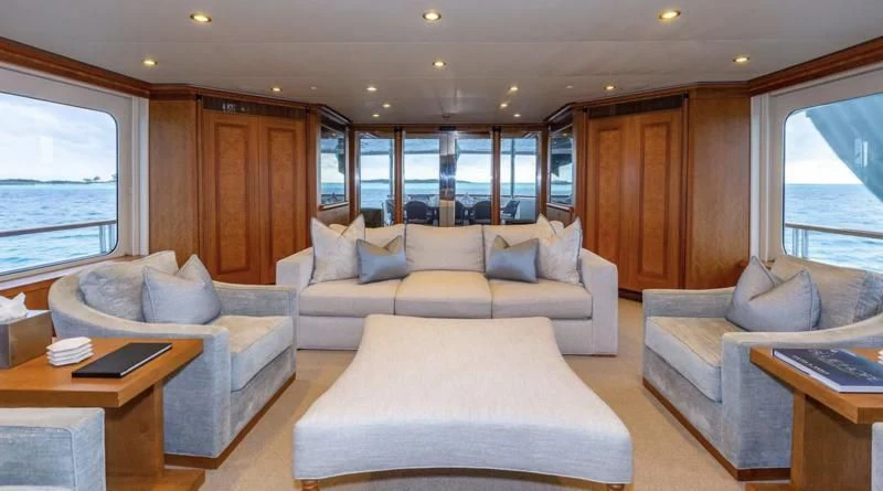 a living room with a couch and a coffee table aboard SEA CLASS Yacht for Sale