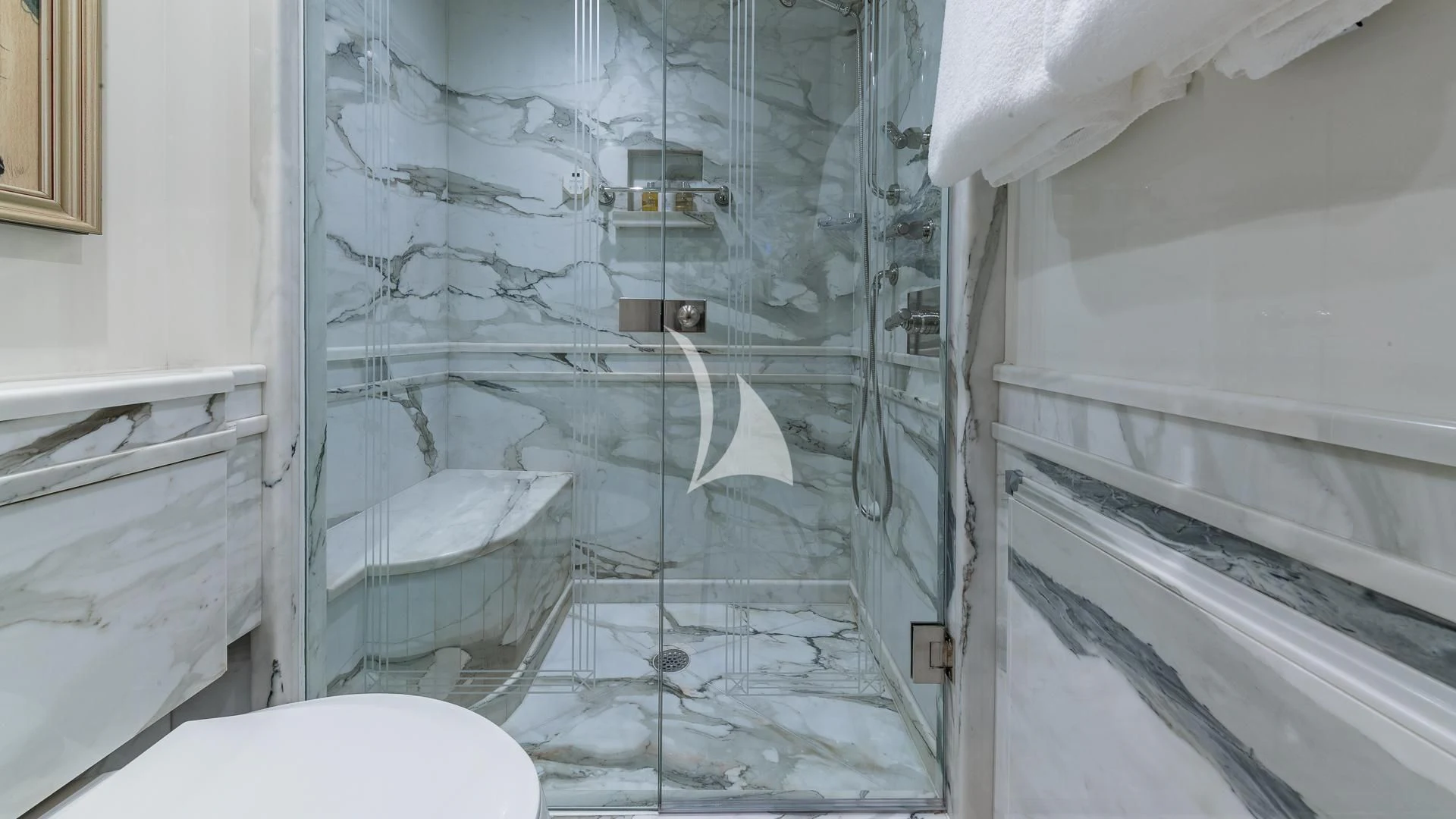a bathroom with a glass shower aboard SEA CLASS Yacht for Sale